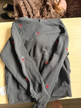 Reflex Black Top with White Brand Tag and Coral Nails